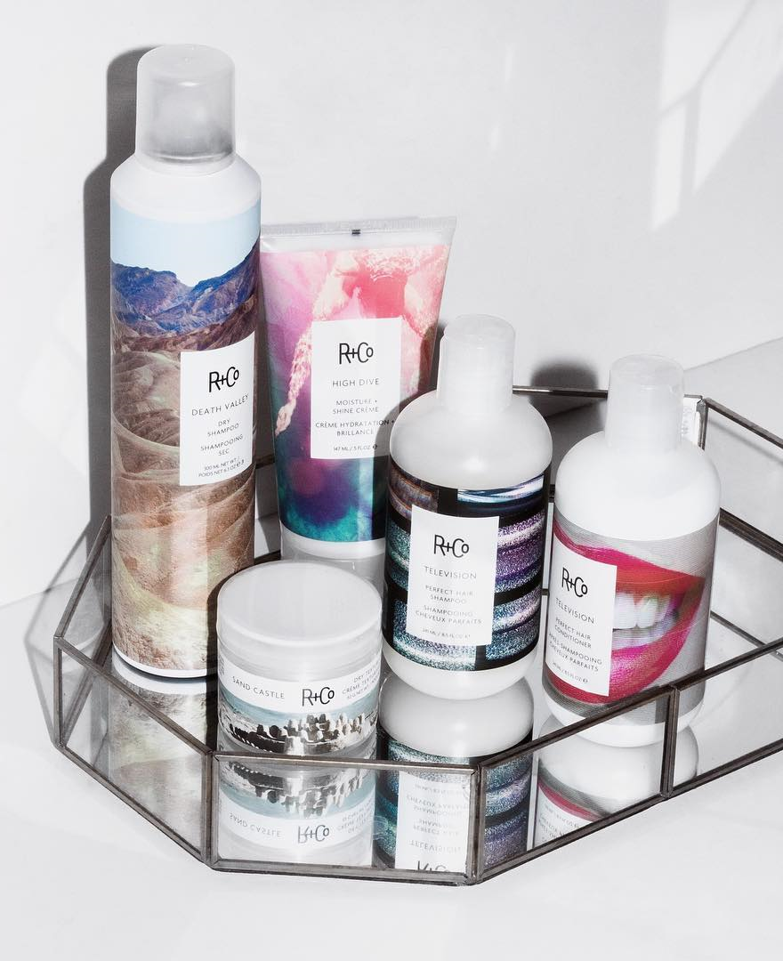 R+Co hair products in a a shower basket